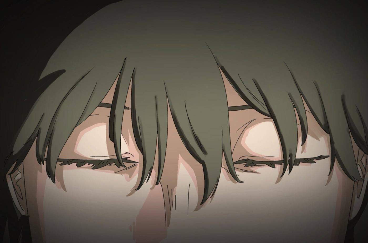 Extreme close-up of closed eyes in shadow.