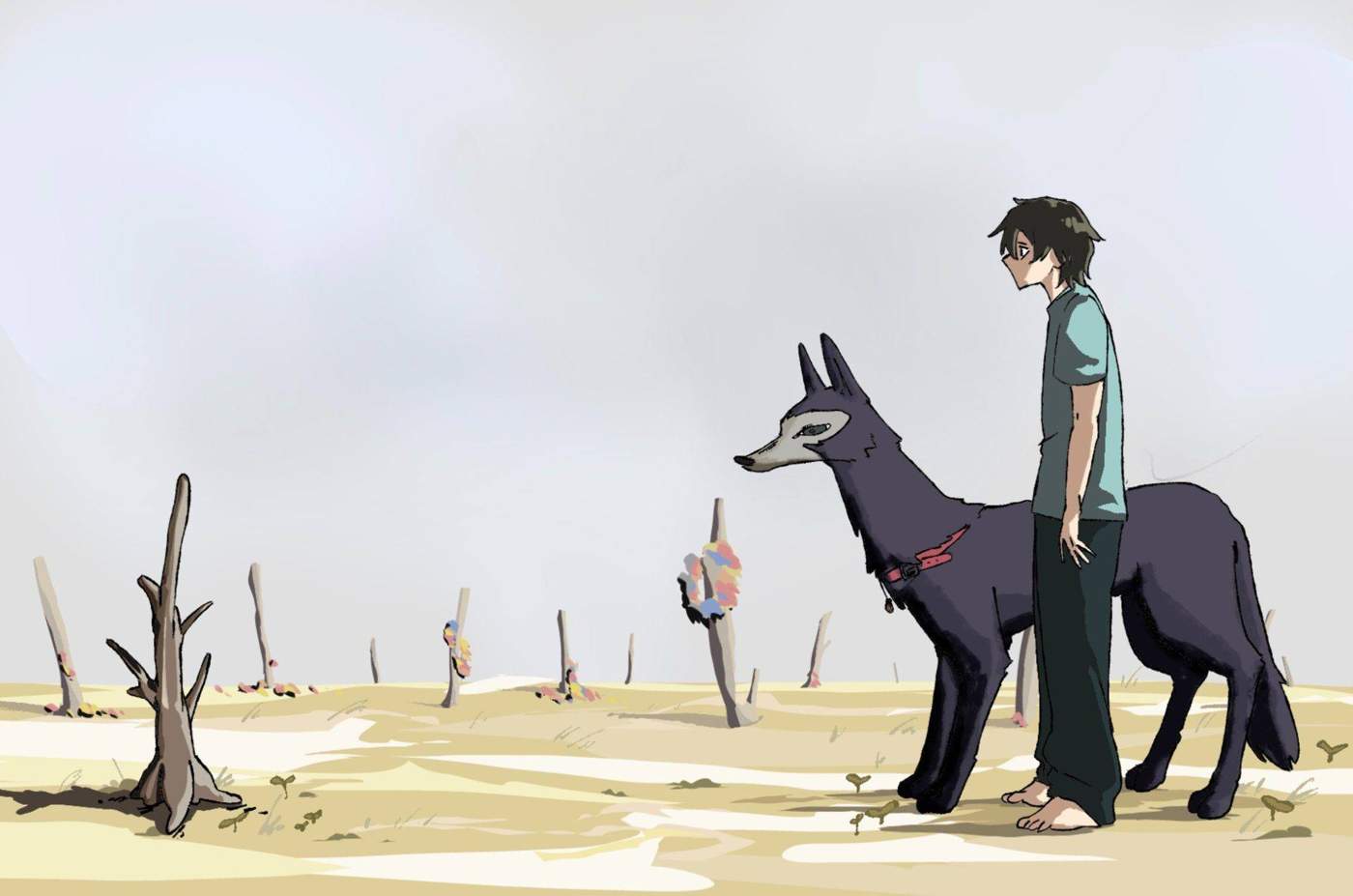 Boy standing beside a dark wolf in a sparse field.